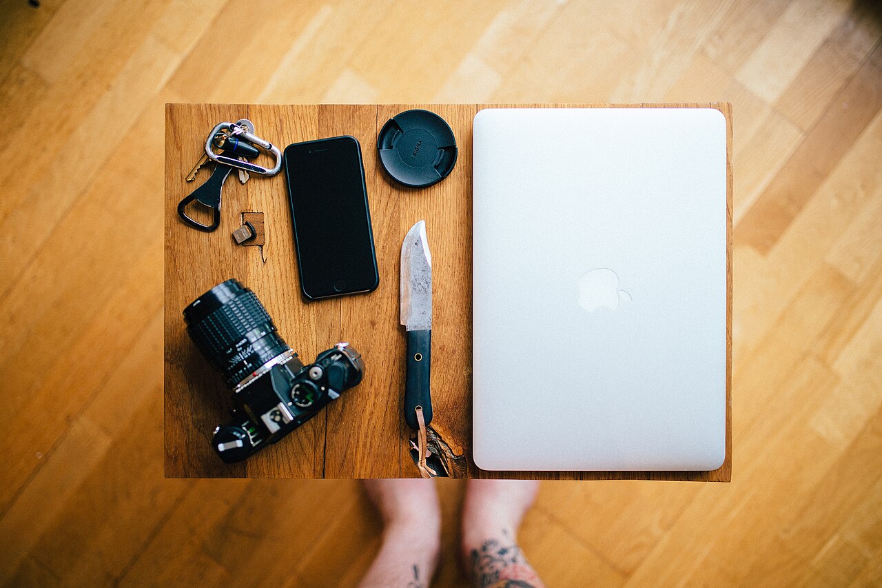 Tabletop with a laptop and a camera