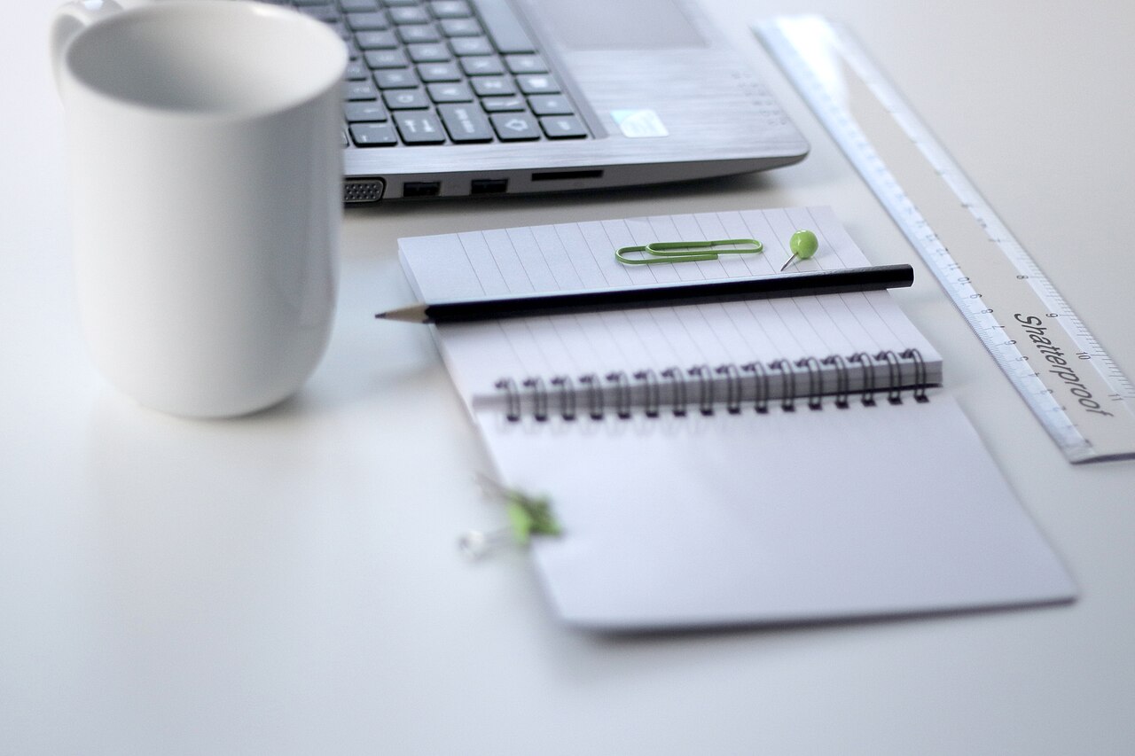 Laptop and a ruler on a clean desk